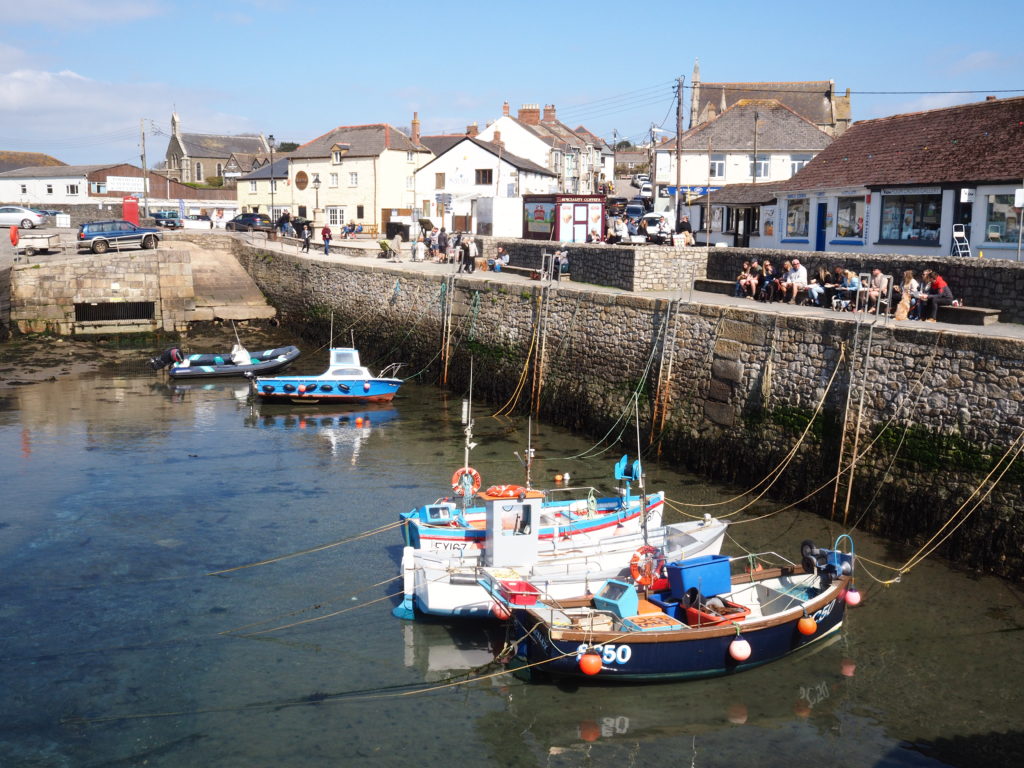 fishing boats moored in the harbour at low tide