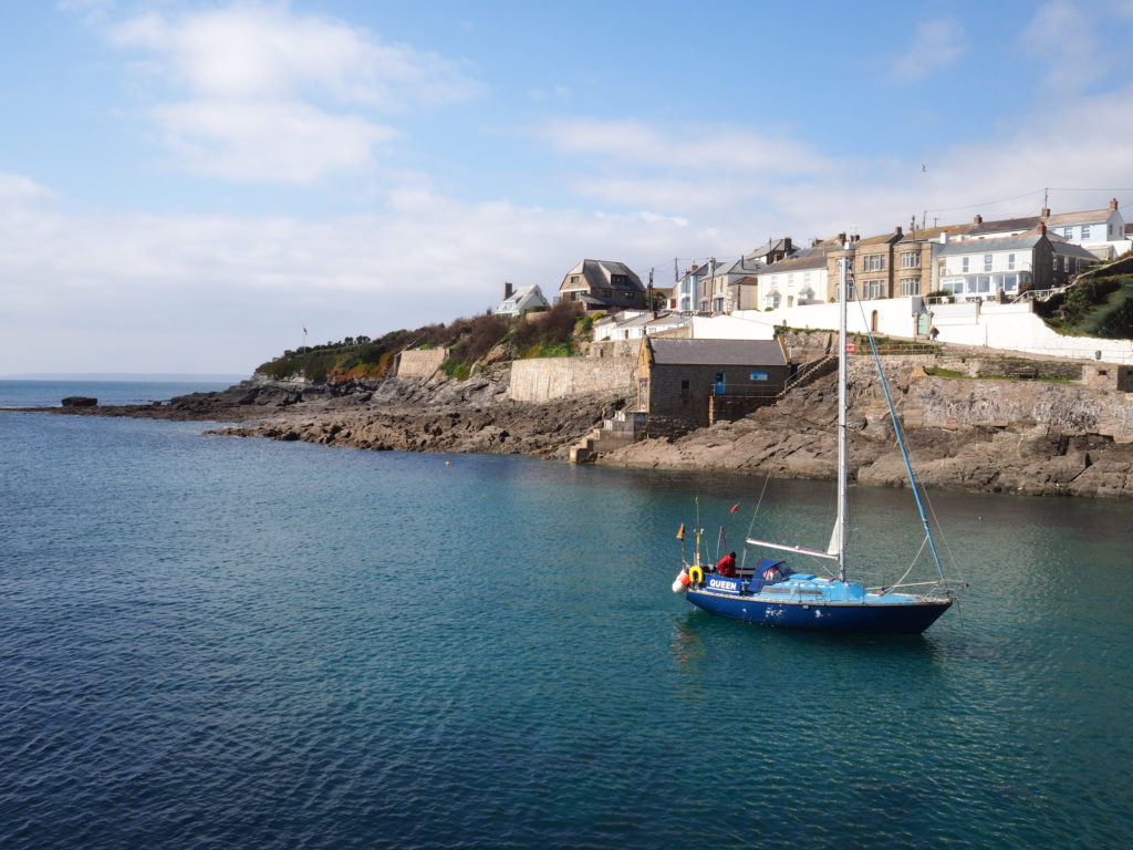 a sailing boat coming in the harbour in Porthleven